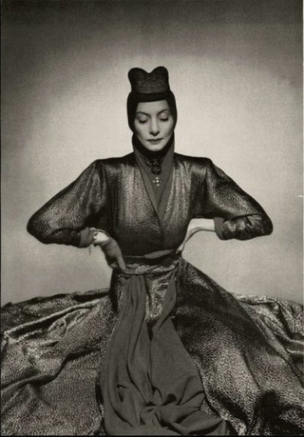 Black and white portrait of a woman in a sculpted gown